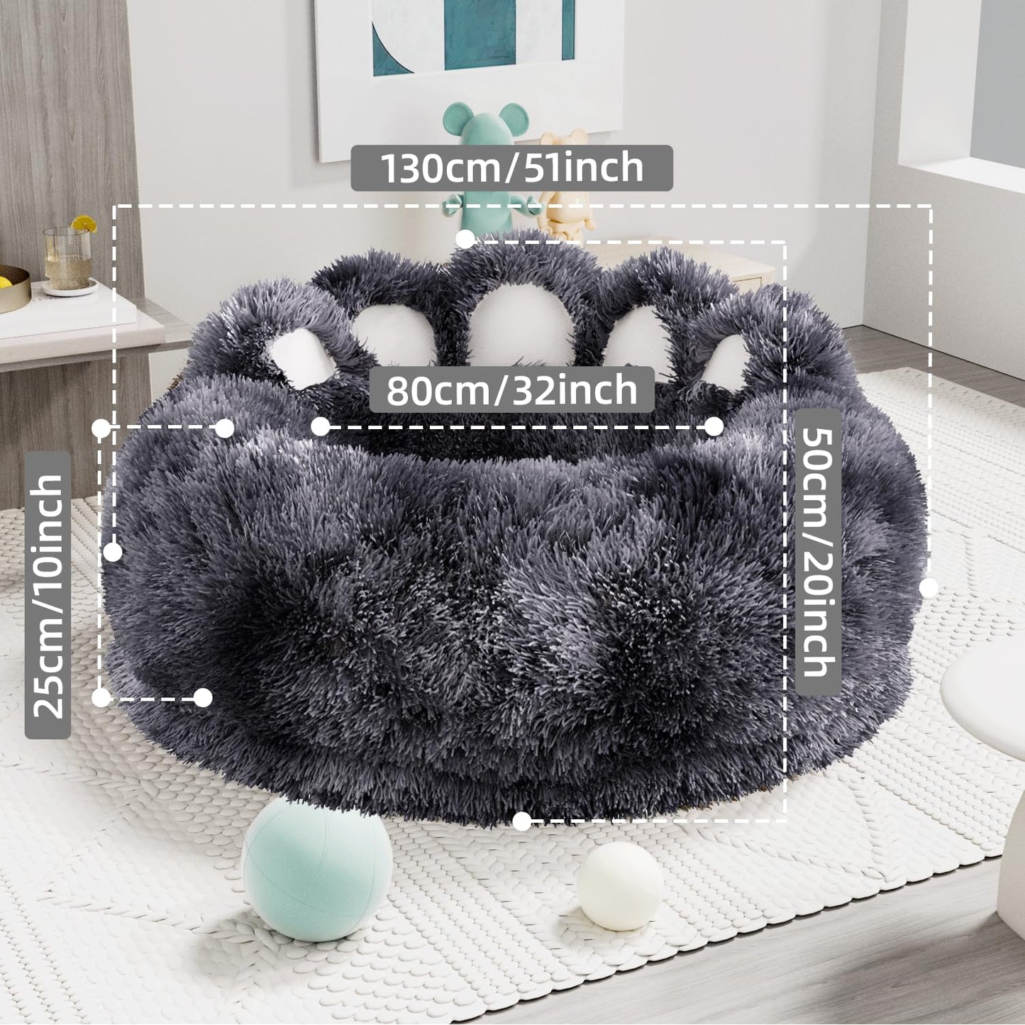 Gray paw-shaped pet bed with measurements on a white rug